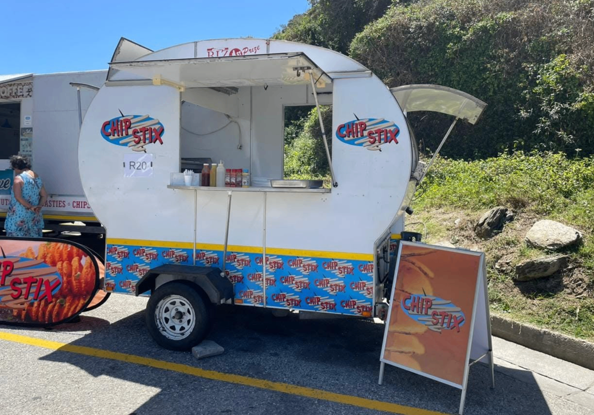 The Chip Stix trailer serving hot slap chips next to the Mamaliousis setup