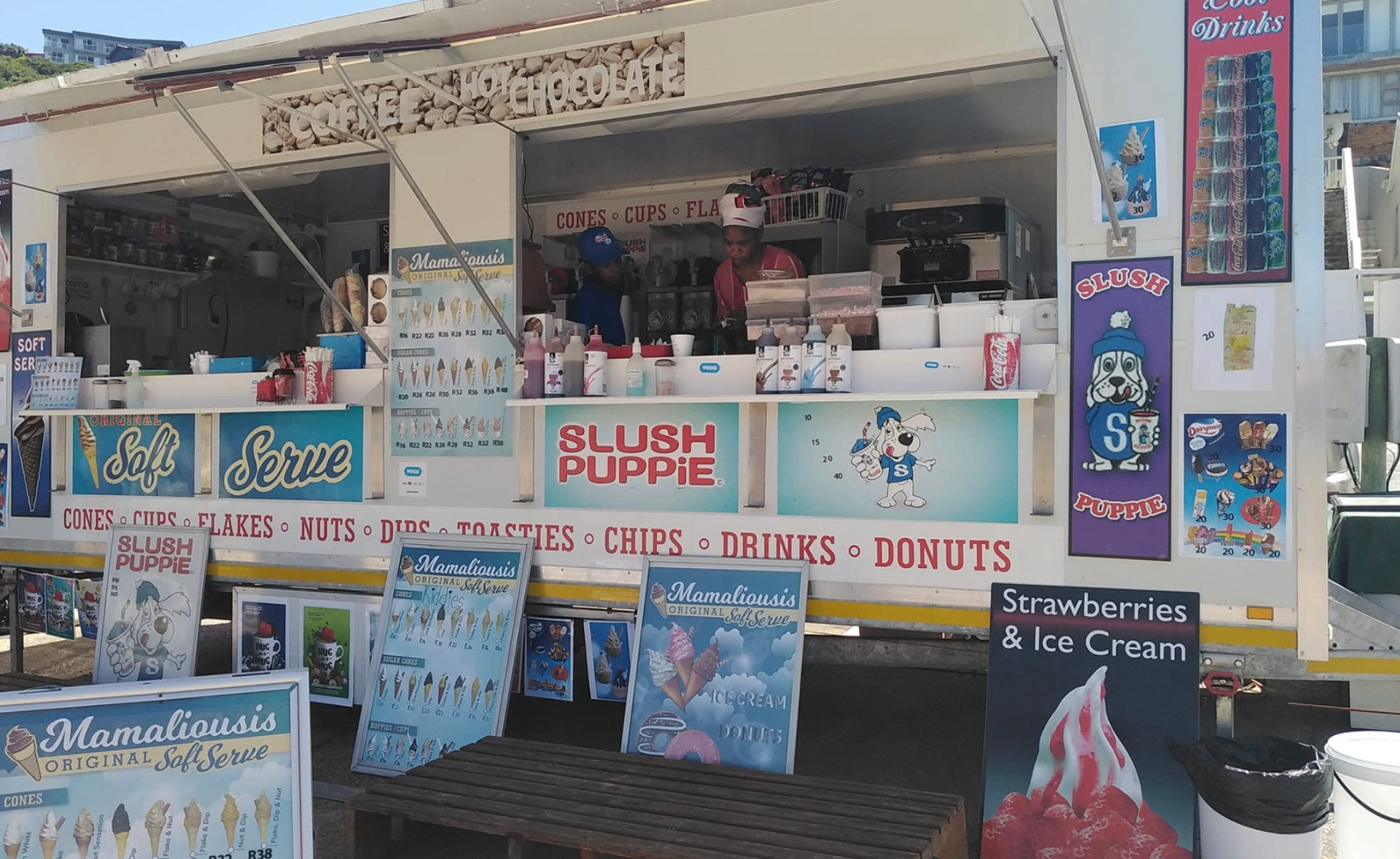 The Mamaliousis stall front with soft serve signage, drinks and the service window open